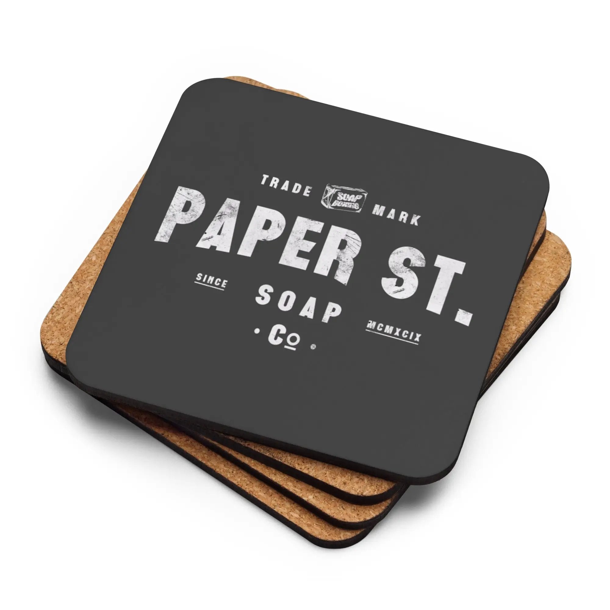 a set of four coasters with paper st logo on them