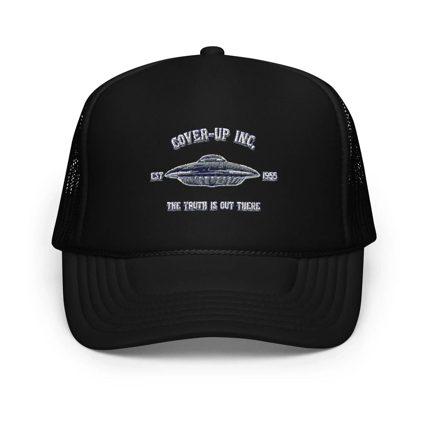 a black trucker hat with an image of a flying saucer
