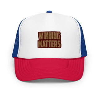 a red and white trucker hat with the words winning matters on it