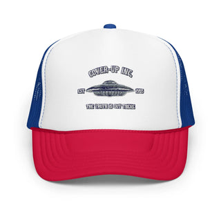 a red, white and blue trucker hat with a flying saucer on it