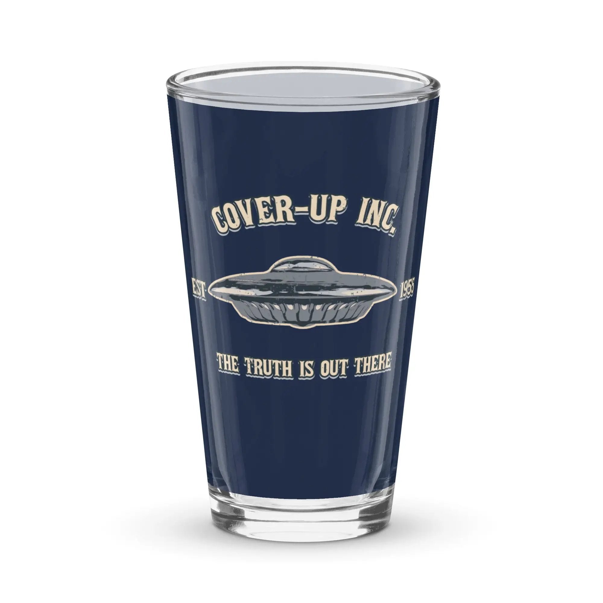 a shot glass that says cover - up inc the truth is out there