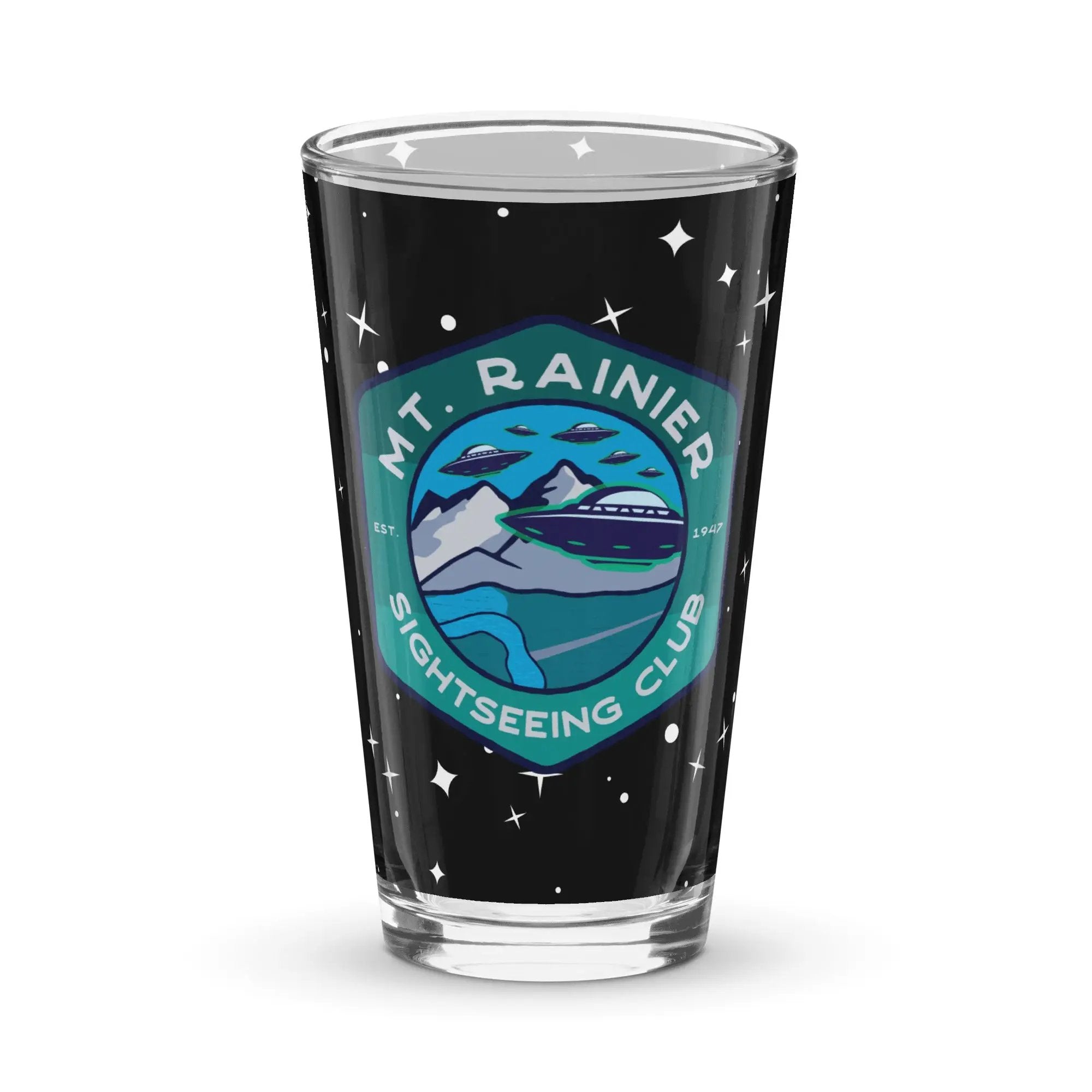 a shot glass with the mt rainer logo on it