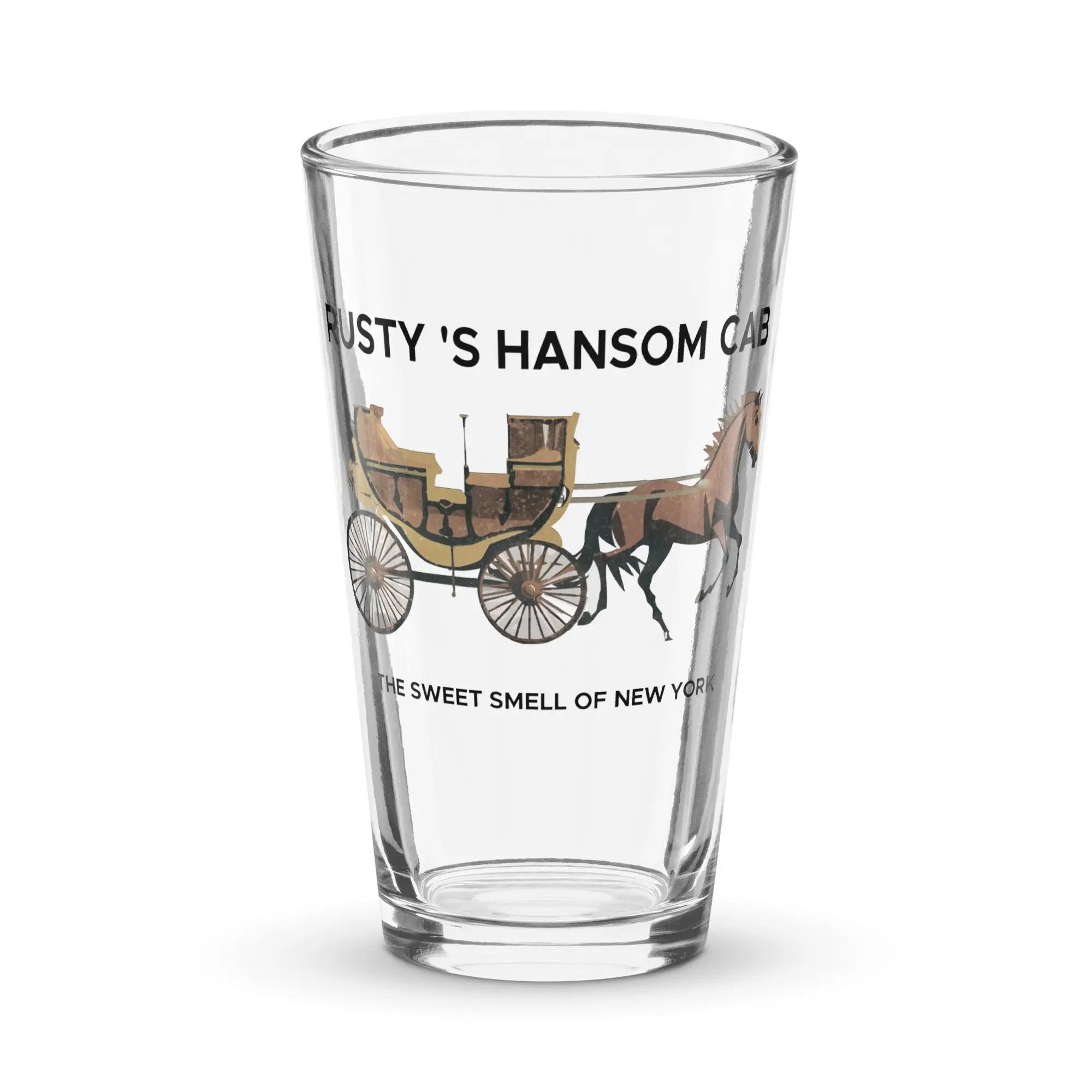 a glass with a horse drawn carriage on it