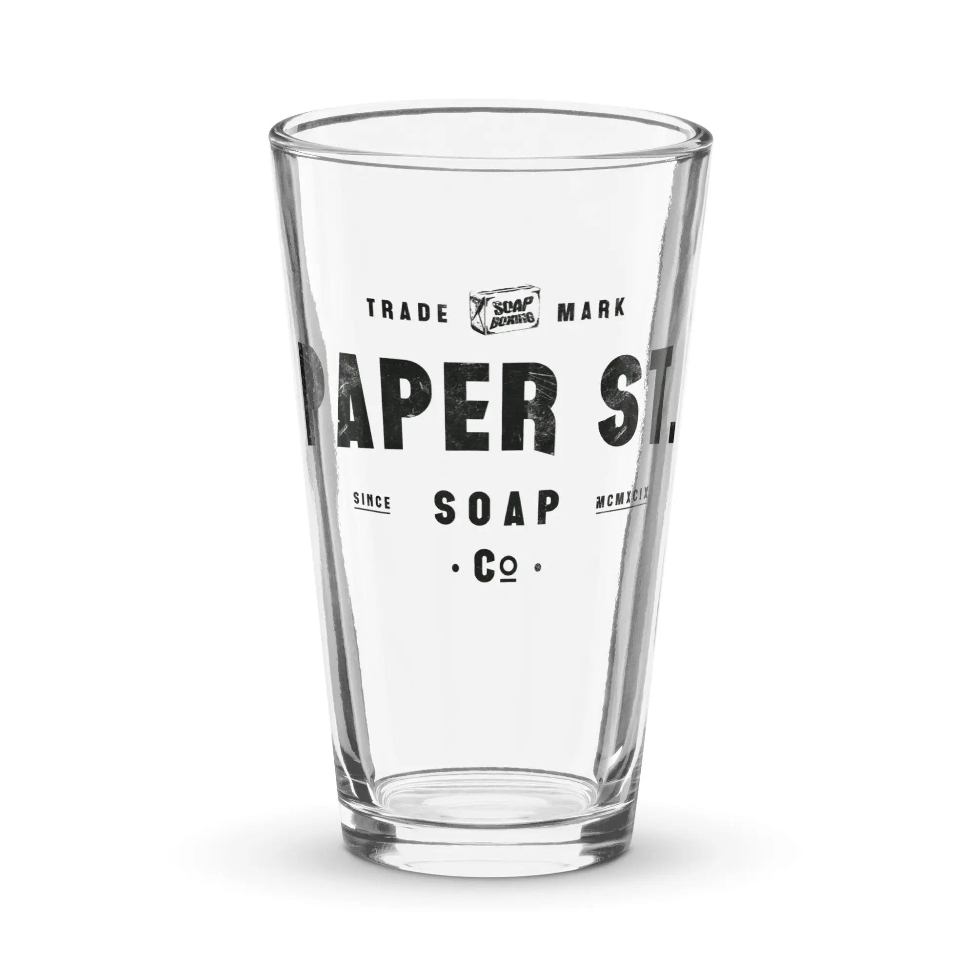 a clear glass with a black and white label on it