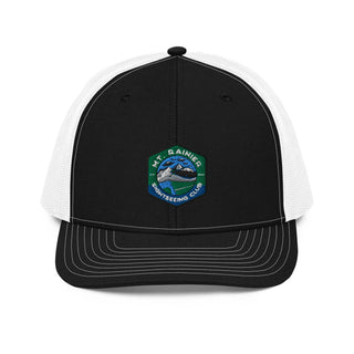a black and white trucker hat with a green and white patch on the front
