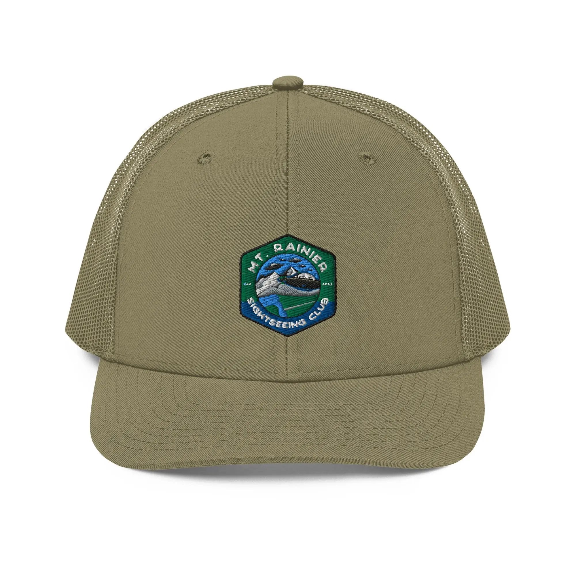 a khaki trucker hat with a patch on the front