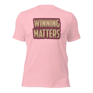a pink t - shirt with the words winning matters printed on it