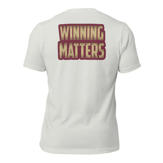 a white t - shirt with the words winning matters printed on it