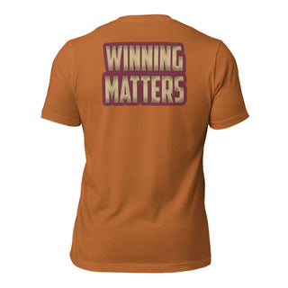 a women's t - shirt with the words winning matters printed on it