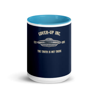 a blue and white coffee mug with the words cover - up inc on it