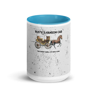 a blue and white coffee mug with a horse drawn carriage