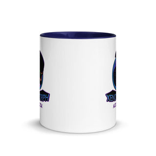 a white and blue coffee mug with a blue rim