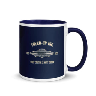 a blue and white coffee mug with the words cover - up inc on it