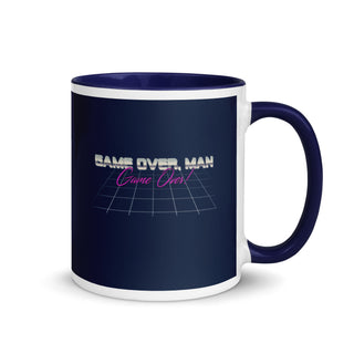 a blue and white coffee mug with the words game over man on it