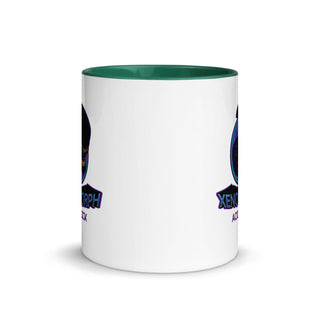 a white coffee mug with a green rim