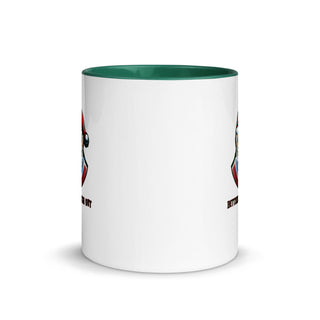 a white coffee mug with a green rim