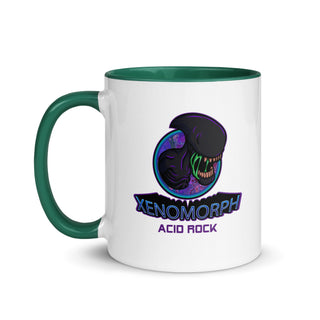 a white and green coffee mug with an image of a dinosaur