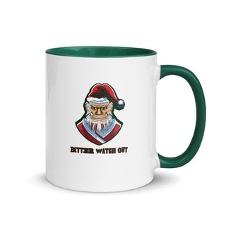 a white and green coffee mug with a santa clause on it