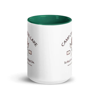 a white coffee mug with a green rim