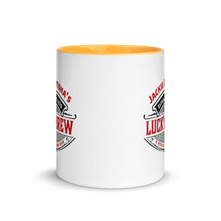 a white coffee mug with a yellow rim