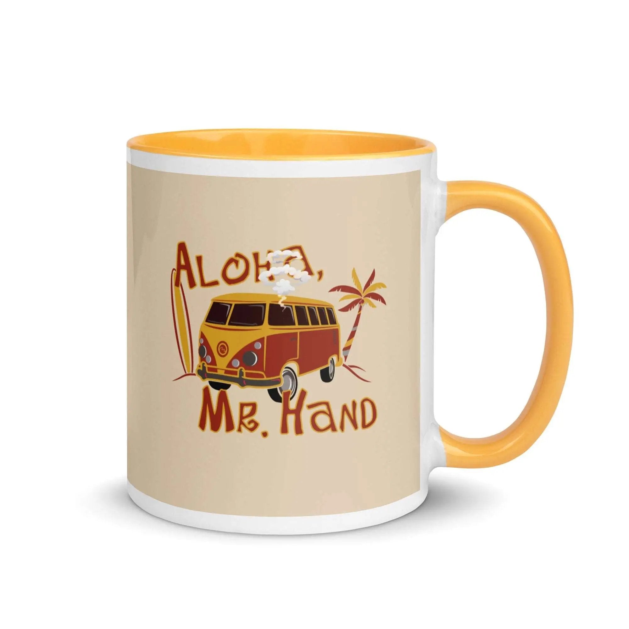 a yellow and white coffee mug with an orange handle