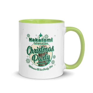 a white and green coffee mug with a christmas party design