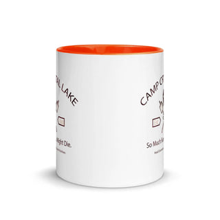 a white coffee mug with an orange rim