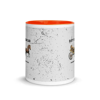 a white and orange coffee mug with a picture of a horse