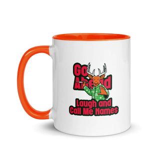 a white and orange coffee mug with an orange handle