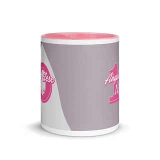 a pink and white coffee mug with a pink handle