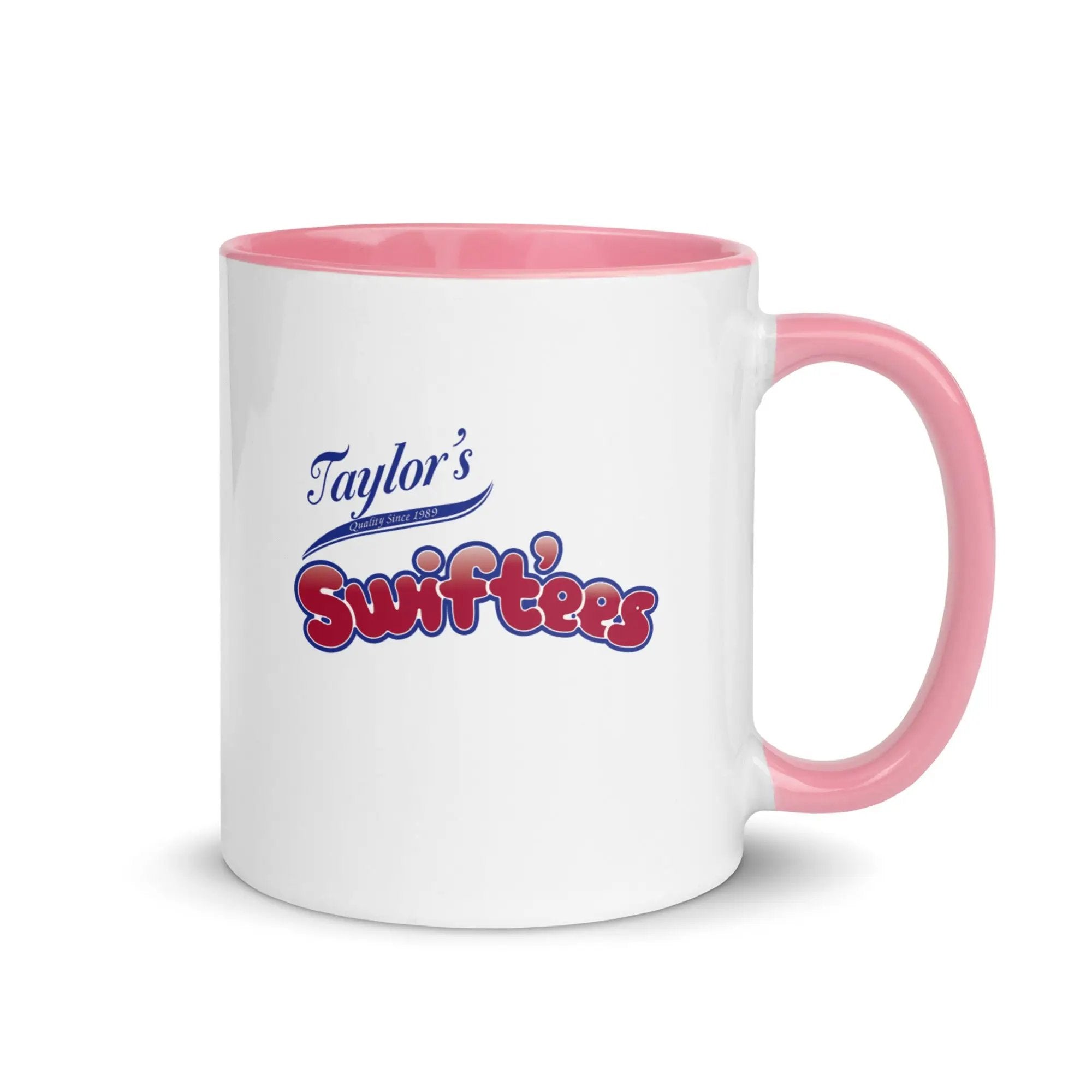 a white and pink coffee mug with taylor's swiftfeasts on it