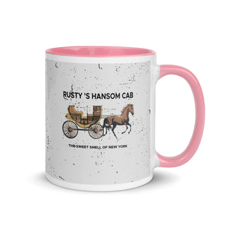 a pink and white coffee mug with a horse drawn carriage