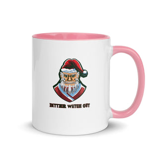 a white and pink coffee mug with a santa clause on it