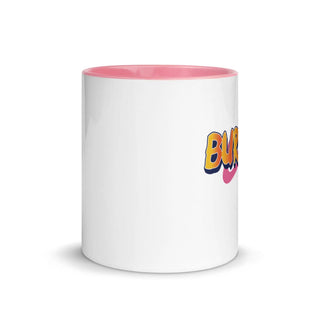 a white and pink coffee mug with the word bla on it