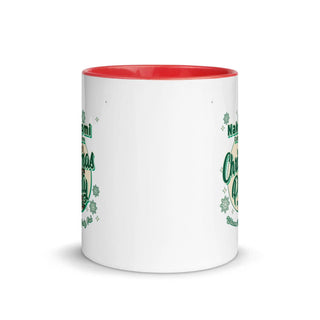 a white and red coffee mug with green lettering