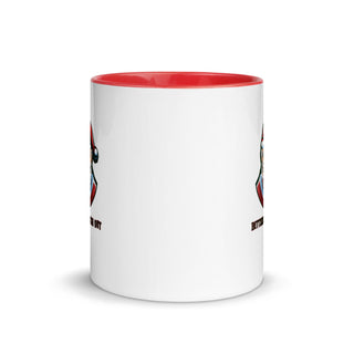 a white and red coffee mug with a red rim