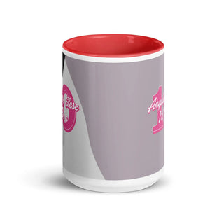 a red and white coffee mug with a pink handle