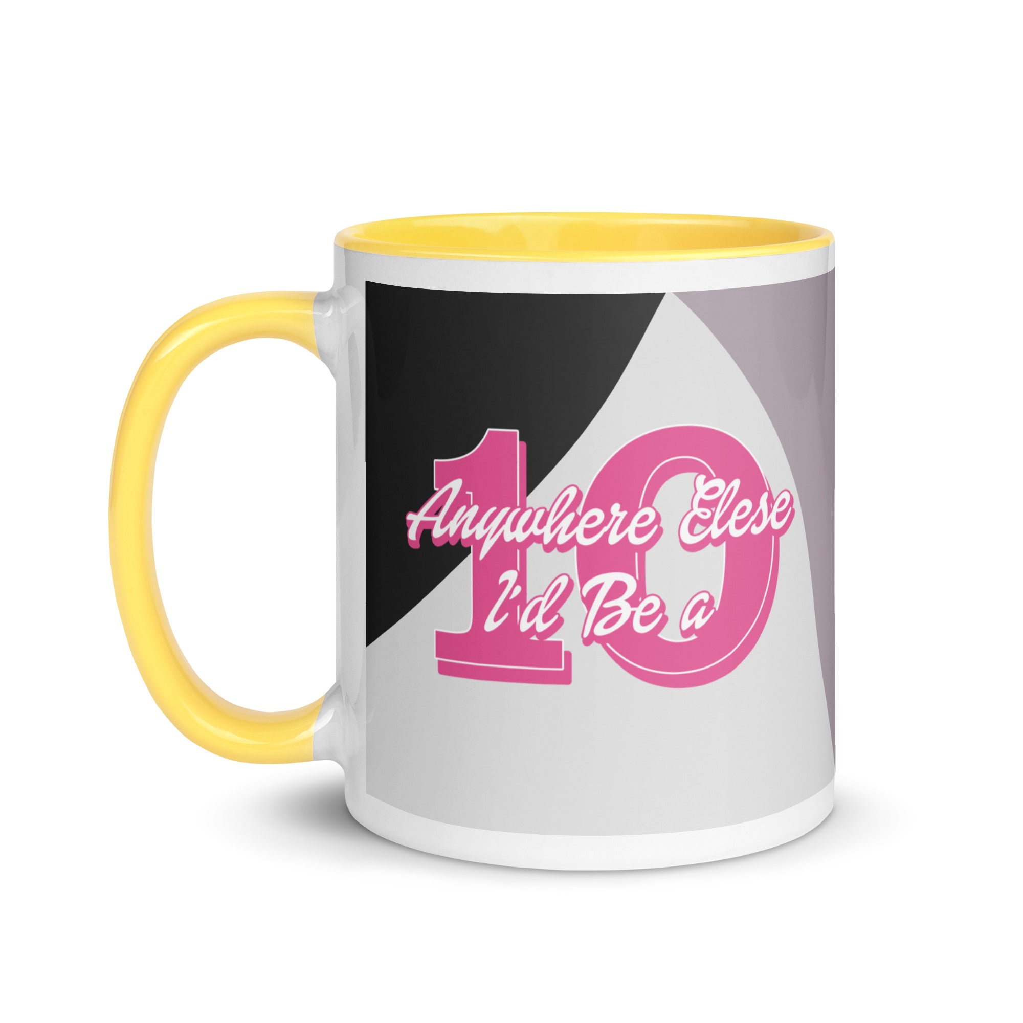 a black and white coffee mug with pink lettering