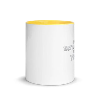 a white and yellow coffee mug with a yellow rim