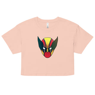 a pink crop top with a graphic of a demon's head