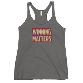 a women's tank top that says winning matters